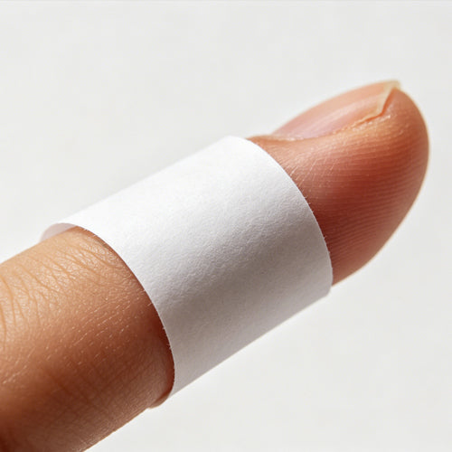1. Take a thin piece of paper and wrap it snugly around the base of your finger.