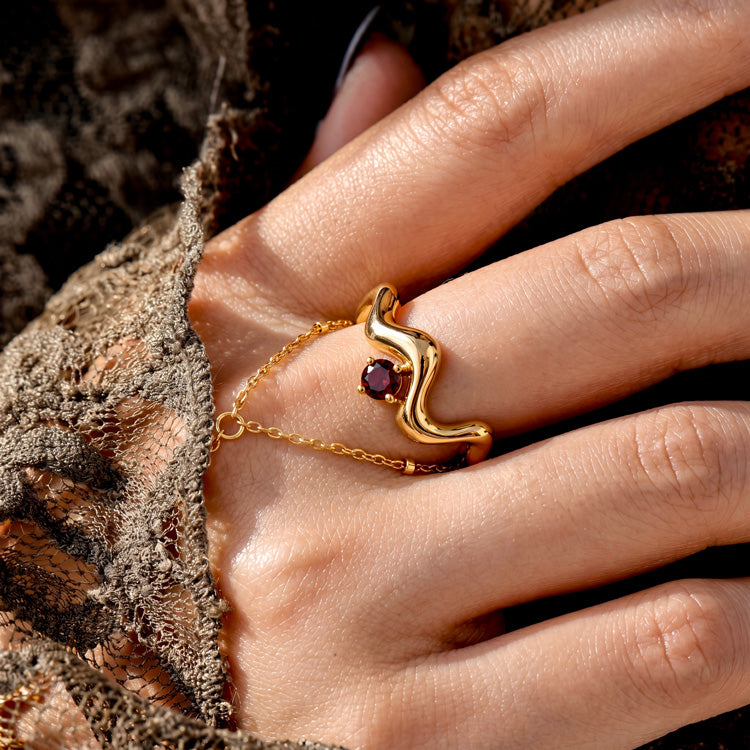 Wave-Twisted Garnet Ring